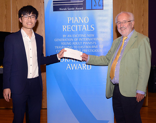 Julian Chan presented with Winner's cheque by Richard Deering - 2023 Norah Sande Award